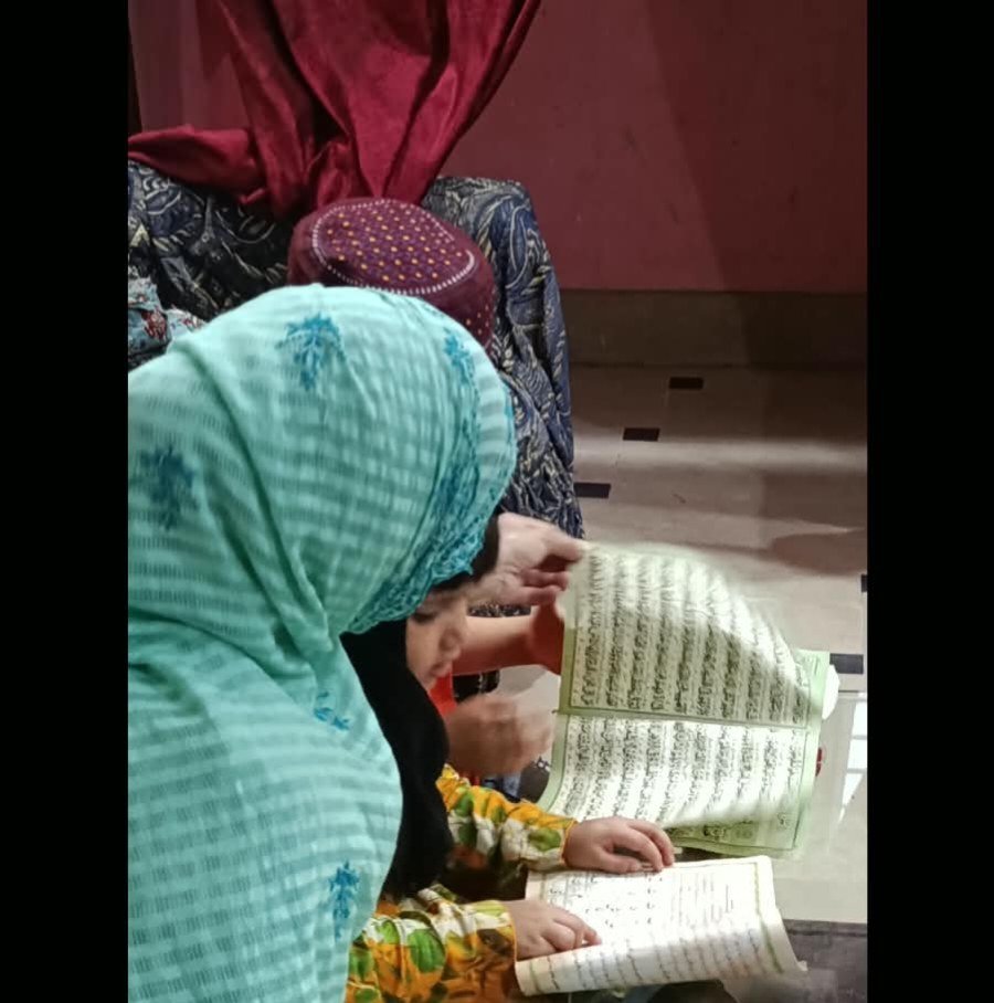 Close-up of student focusing on correct Arabic pronunciation and Tajweed